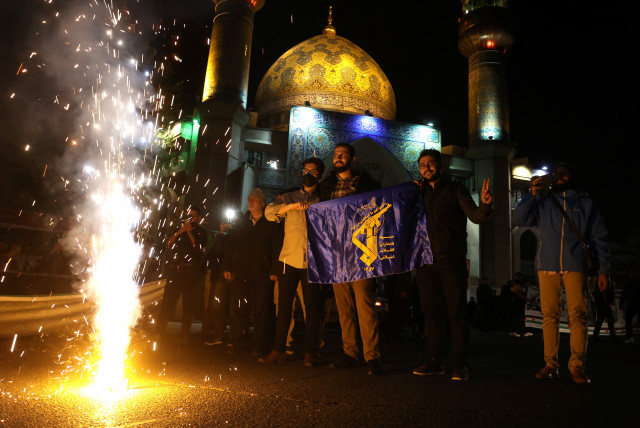 Iranians celebrate on a street, after the IRGC attack on Israel, in Tehran, Iran, April 14, 2024. (credit: VIA REUTERS)