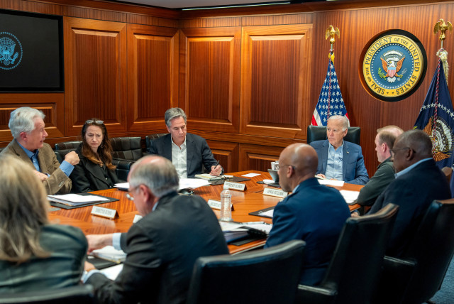  U.S. President Joe Biden meets with members of his national security team as seen in this White House handout image taken in the Situation Room at the White House, in Washington, U.S., April 13, 2024. (credit: The White House/Handout via REUTERS)