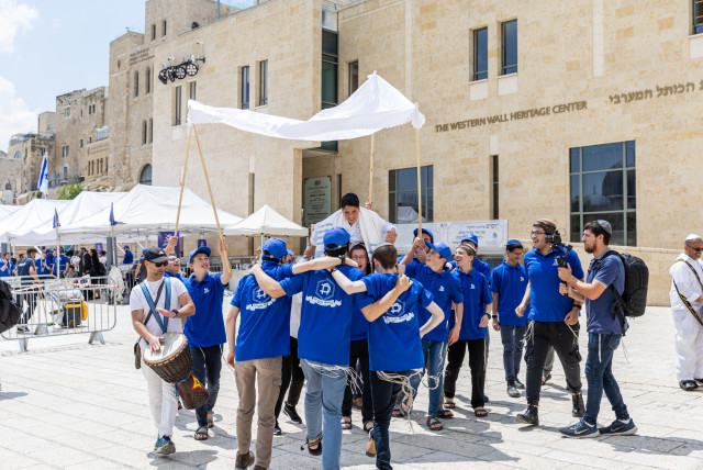  Refael, who lost his father when he was seven, celebrates his bar mitzvah at the Western Wall. (credit: MENDY KORNET)