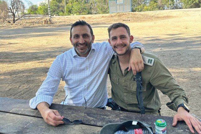  RABBI DORON PEREZ WITH Daniel outside Nahal Oz Base, on the Shabbat before Rosh Hashanah. (credit: Perez family)