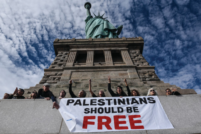  JEWISH VOICE for Peace ‘activists’ occupy of the Statue of Liberty pedestal, in New York City,  Nov. 6, 2023. (credit: STEPHANIE KEITH/ GETTY IMAGES)