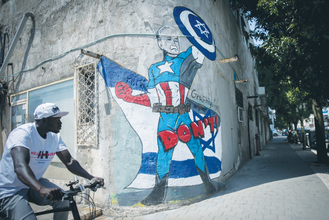  A MURAL in Tel Aviv depicts US President Joe Biden as a superhero defending Israel against the Iranian attack. On the strategic level, Israel suffered a whopping loss as Iran pierced American and Israeli deterrence frameworks with apparent impunity, the writer maintains. (credit: MIRIAM ALSTER/FLASH90)