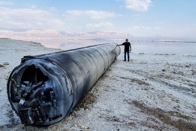   A ballistic missile lies on the shore of the Dead Sea, after Iran launched drones and missiles towards Israel, April 14, 2024. (credit: REUTERS/Alon Ben Mordechai)