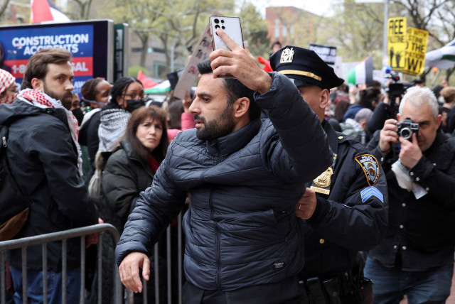  Israeli Arab activist Yoseph Haddad shortly after being physically assaulted by a pro-Palestinian demonstrator at a protest near the Columbia University on Thursday, April 18, 2024. (credit: REUTERS/CAITLIN OCHS)