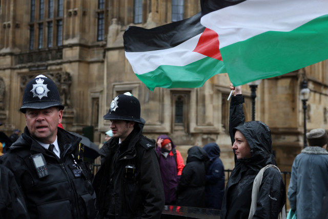  Police officers keep watch as campaigners queue to lobby MPs in Parliament ahead of a debate to hold a vote for a ceasefire in Gaza, amid the ongoing conflict between Israel and the Palestinian Islamist group Hamas, in London, Britain, February 21, 2024. (credit: REUTERS/Isabel Infantes)