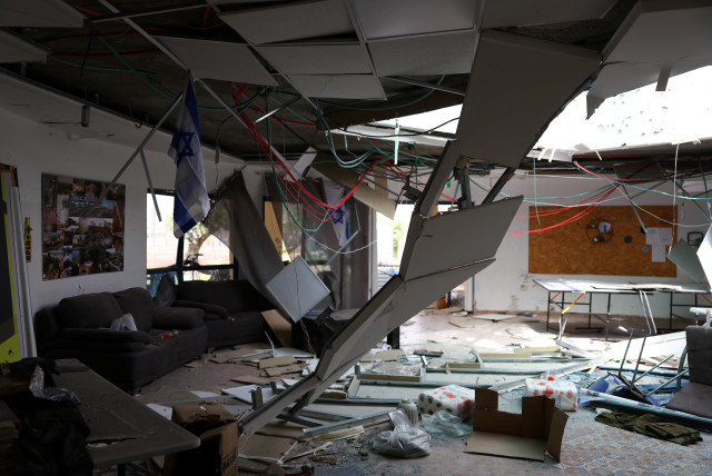  Debris covers the floor of a damaged community center, the day after Hezbollah launched missiles and drones at the Bedouin village of Arab al-Aramshe, amid ongoing cross-border hostilities between Hezbollah and Israel, in northern Israel April 18, 2024. (credit: Hannah McKay/Reuters)