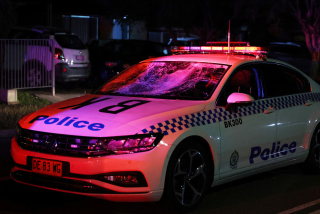  A police vehicle with a smashed windshield is seen after police held back an angry mob following a stabbing at Christ The Good Shepherd Church in the suburb of Wakeley in Sydney, Australia, April 15, 2024. (credit: AAP IMAGE/PAUL BRAVEN VIA REUTERS)