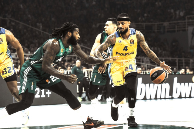  MACCABI TEL AVIV’S Lorenzo Brown (right) dribbles against Panathinaikos defender Mathias Lessort during the yellow-and-blue’s 91-87 victory. (24/4/2024) (credit: TOURRETTE PHOTOGRAPHY/ANDREAS PAPAKONSTANTINOU)