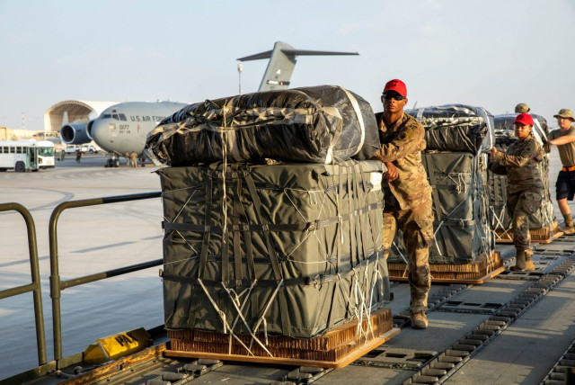  U.S. Air Force members work on the preparation of a humanitarian aid drop for Gaza residents, in this picture released on March 5, 2024. (credit:  US Central Command via X/Handout via REUTERS )
