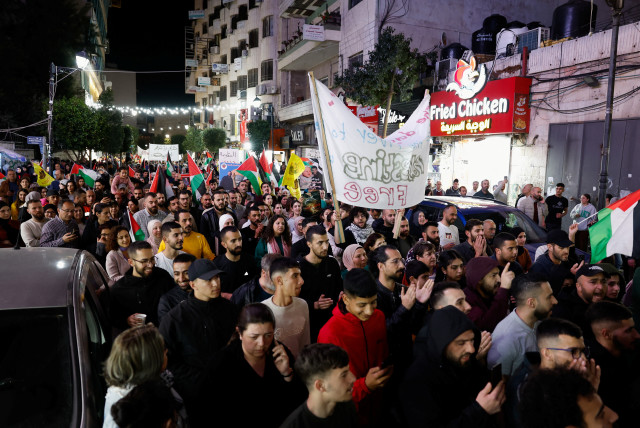  Palestinians participate in a protest to mark 'Land Day' and to show their support with Gaza, in the West Bank city of Ramallah, in the West Bank March 30, 2024.  (credit: REUTERS/Mohammed Torokman)