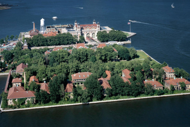  AERIAL VIEW of Ellis Island, which was inaugurated in 1892 and served as an immigration station until its 1954 closure. With millions of immigrants to pass through its doors over 60 years, some 40% of Americans can trace an ancestor back to the island. (credit: Wikimedia Commons)