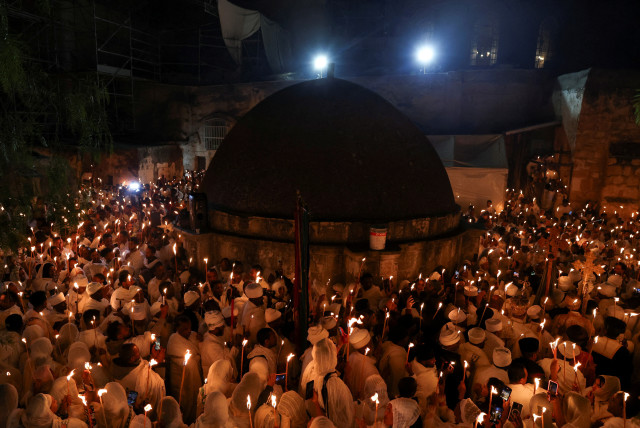 Ethiopian Orthodox faithfull take part in the Holy Fire ceremony at the Ethiopian section of the Church of the Holy Sepulchre in Jerusalem's Old City, May 4, 2024. (credit: REUTERS/SHANNON STAPLETON)
