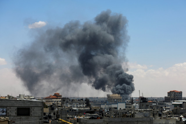  Smoke rises after an Israeli strike as Israeli forces launch a ground and air operation in the eastern part of Rafah, in the southern Gaza Strip May 7, 2024. (credit: REUTERS/Hatem Khaled)