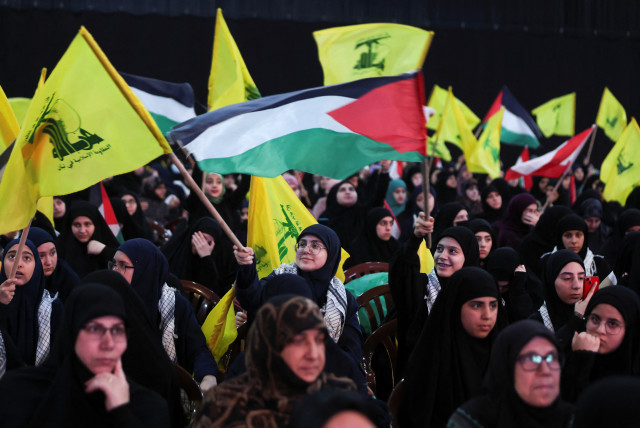  Supporters wave flags as they wait for Lebanon's Hezbollah leader Sayyed Hassan Nasrallah to speak, April 8, 2024. (credit: REUTERS/MOHAMED AZAKIR)