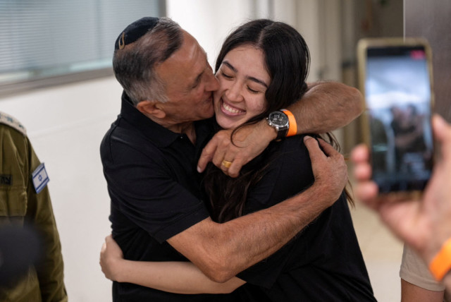  Noa Argamani, a rescued hostage embraces her father, Yakov Argamani, after the military said that Israeli forces have rescued four hostages alive from the central Gaza Strip, in Ramat Gan, Israel, in this handout image obtained by Reuters on June 8, 2024. (credit: VIA REUTERS)