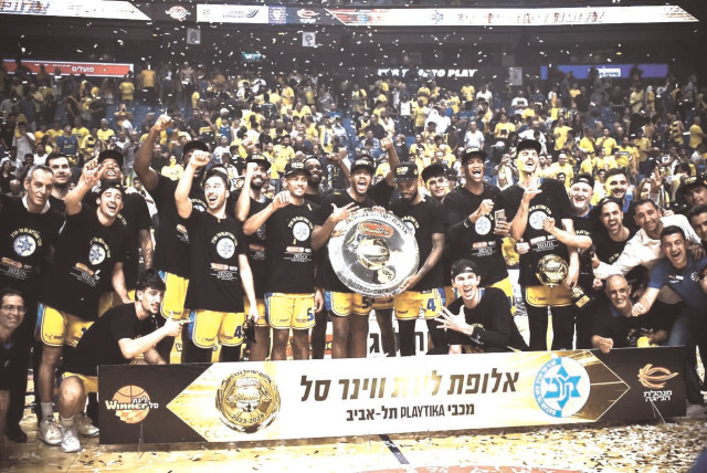  MACCABI TEL AVIV celebrates after clinching the Israel league championship with a 82-74 Game 3 win over Hapoel Tel Aviv. (credit: YEHUDA HALICKMAN)