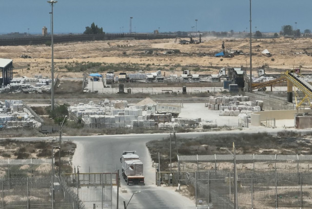  Trucks carrying aid are seen entering the Gaza Strip through the Kerem Shalom, June 18, 2024 (credit: IDF SPOKESPERSON'S UNIT)