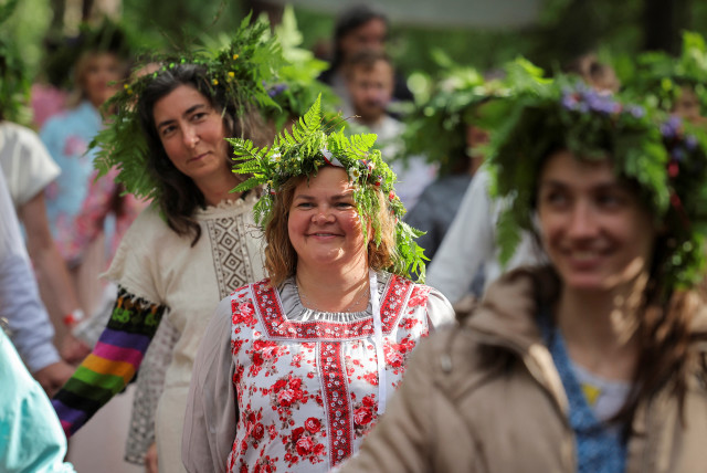 People attend a Ivan Kupala festival, marking the day of the summer solstice, in Leningrad Region, Russia June 20, 2024. (credit: REUTERS/ANTON VAGANOV)