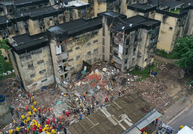 Seven dead and nine missing as three-story mall COLLAPSES while