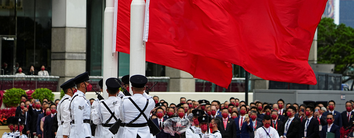  Police officers raise Chinese and Hong Kong flags during a ceremony to mark the Chinese National Day in Hong Kong, China October 1, 2022.