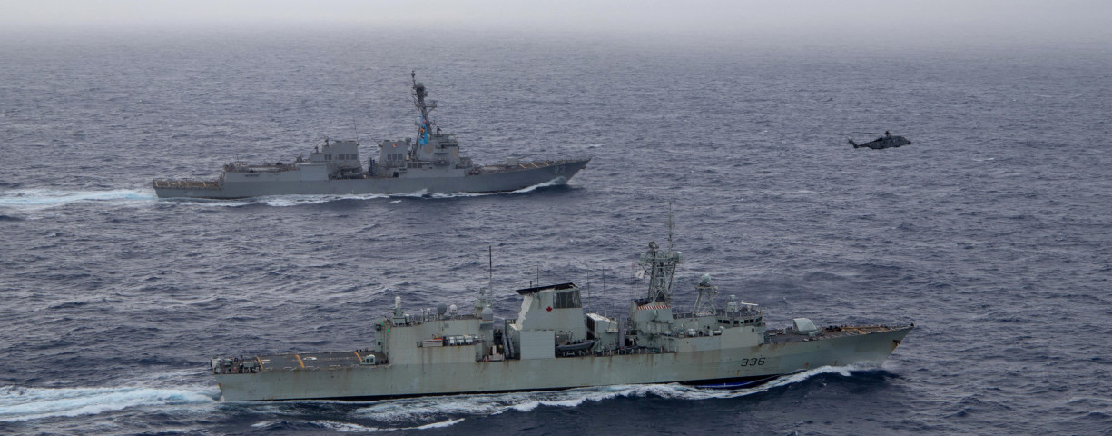  U.S. Navy guided-missile destroyer USS Chung-Hoon sails alongside the Royal Canadian Navy frigate HMCS Montreal during Surface Action Group operations as a part of exercise “Noble Wolverine" in the South China Sea May 30, 2023.