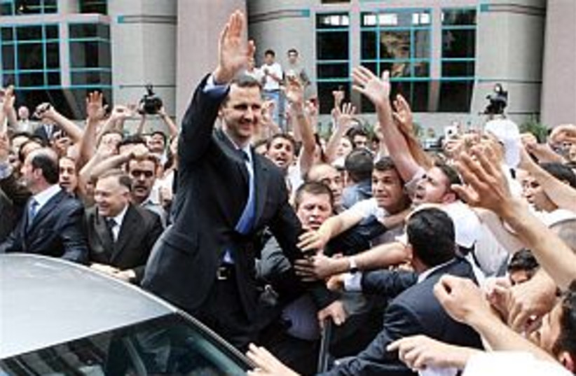 Assad waves to crowd 298 (photo credit: AP)