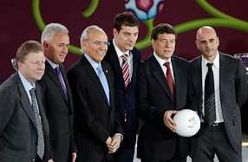 Group F coaches and officials (photo credit: ASSOCIATED PRESS)