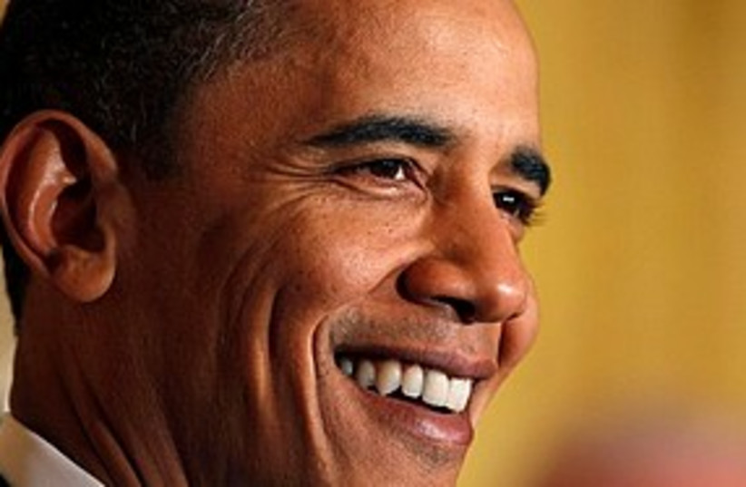 Obama smiles 311 (photo credit: Associated Press)