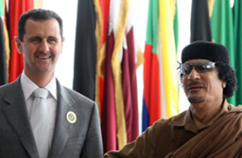 Gahdafi and Assad (photo credit: AP)