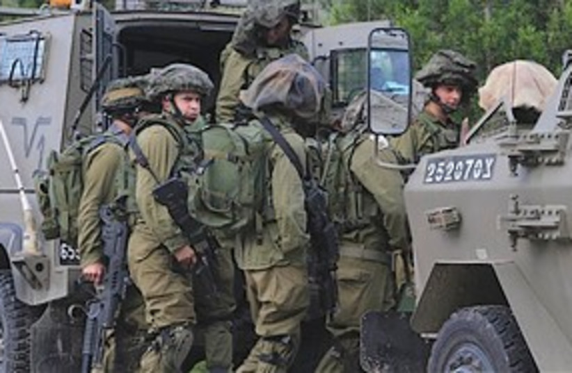 IDF soldiers at Gaza border 311 (photo credit: Associated Press)