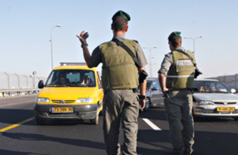 Soldiers open highway 443 311 (photo credit: Ariel Jerozolimski/The Jerusalem Post)