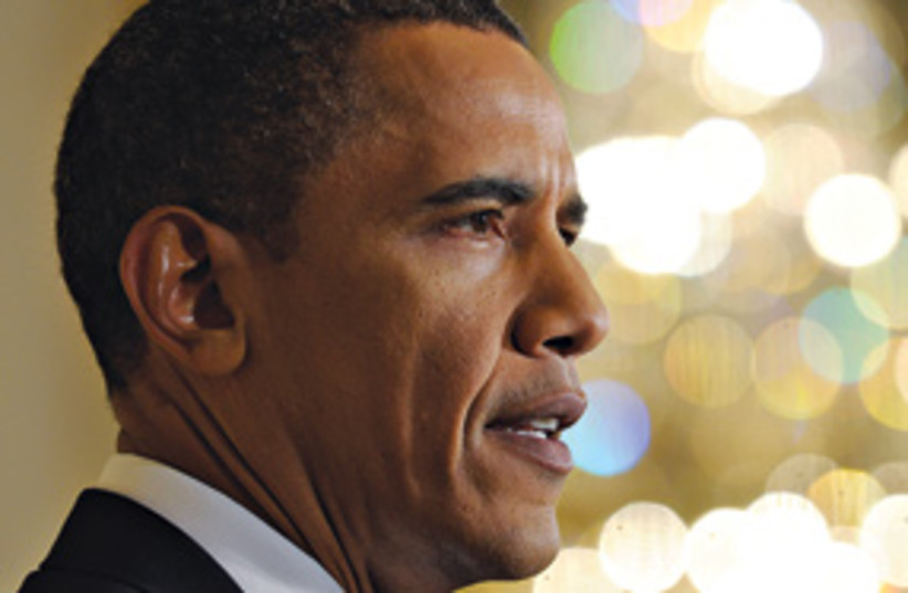Obama harsh features (photo credit: Associated Press)