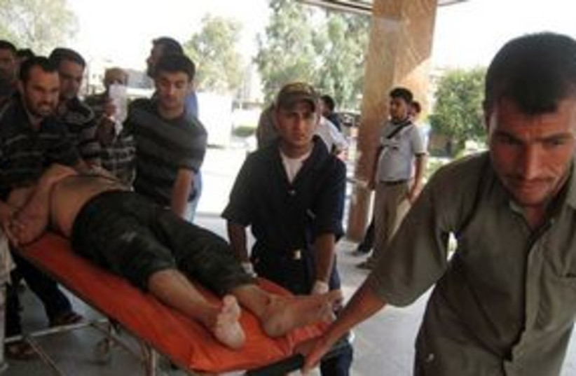 311_iraq violence victim (photo credit: Associated Press)