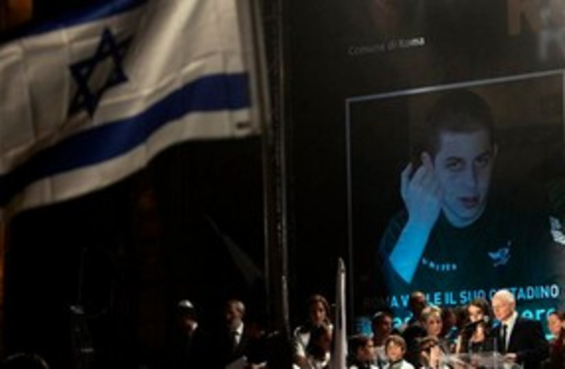 Gilad Schalit image + dad 311 (photo credit: Associated Press)