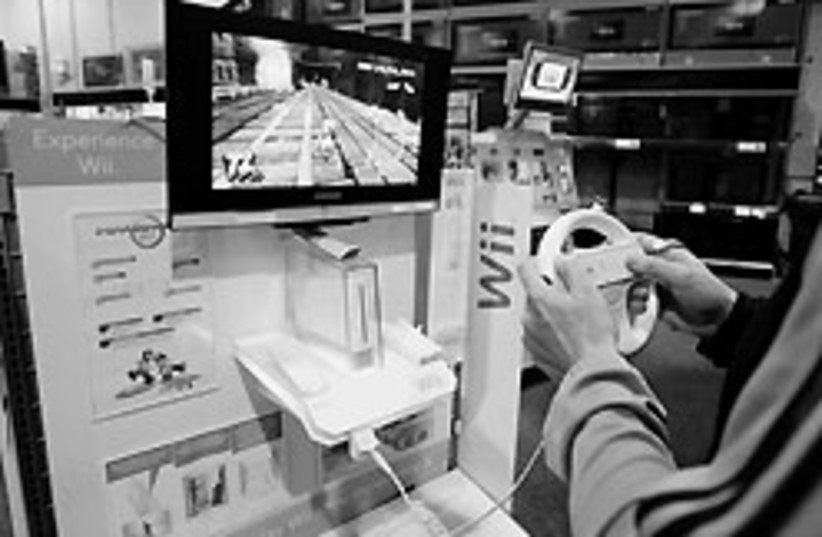 A customer plays a game on a Nintendo Wii at Best  (photo credit: ap)