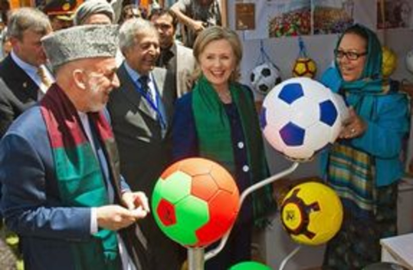 311_Karzai and Clinton (photo credit: Associated Press)