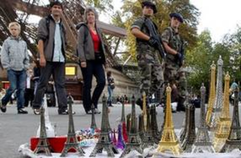 311_French defending their souvenirs from tourists (photo credit: Associated Press)