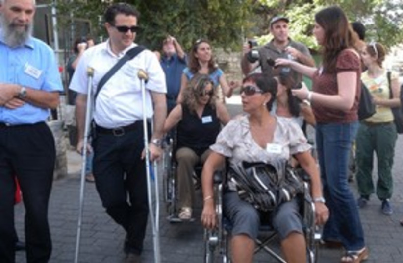 People in wheelchair 311 (photo credit: Melanie Lidman)