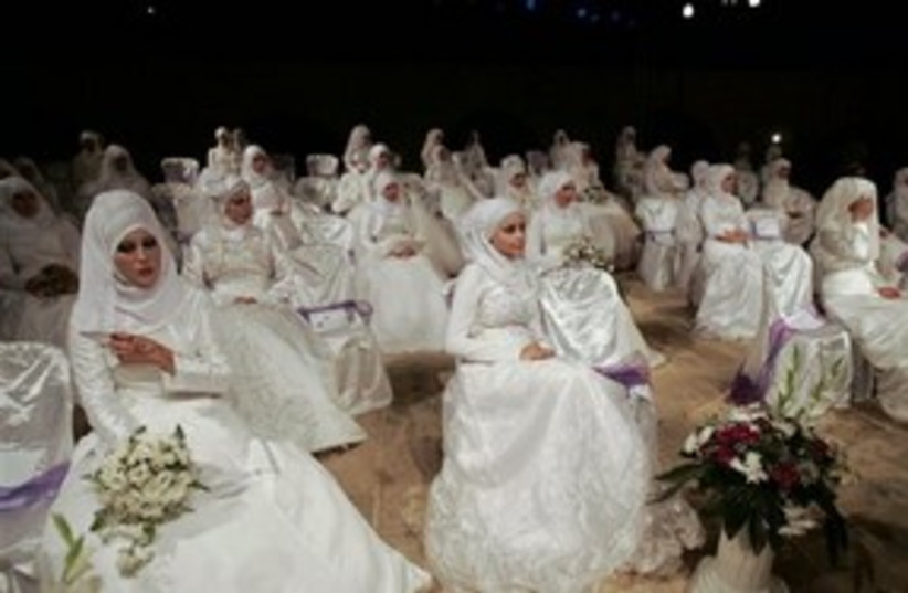 Palestinian brides at mass wedding in Nablus 311 AP (photo credit: AP)