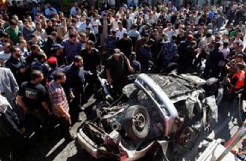 Gaza explosion in car with crowd (photo credit: ASSOCIATED PRESS)
