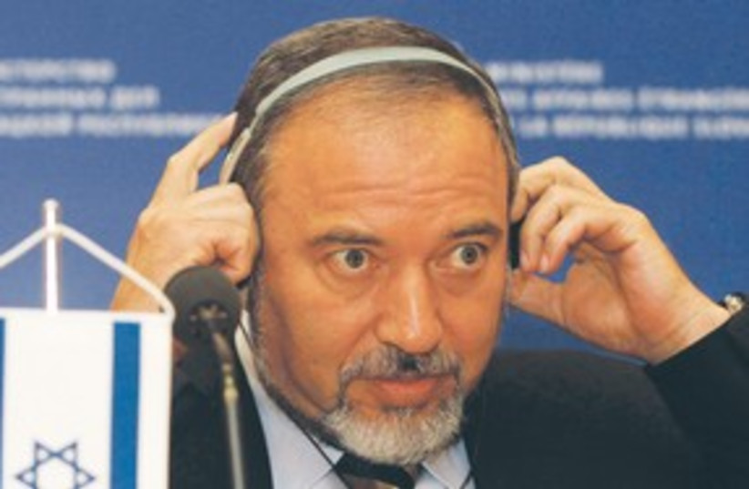 Lieberman with headphones 311 (photo credit: AP)