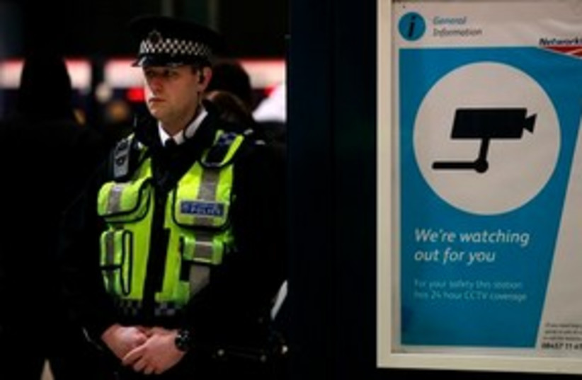 British police at airport ''watching you'' 311 AP (credit: AP)
