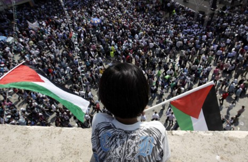 Palestinians rallying for statehood in Ramallah GAL (credit: REUTERS/Ammar Awad)