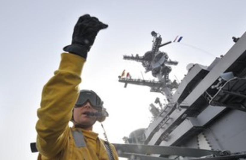 US Navy crew member 311 (R) (photo credit: Reuters)