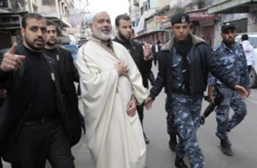Haniyeh and bodyguards_311 (photo credit: Reuters/Ismail Zaydah)