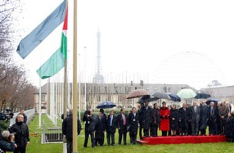 The Palestinian flag is raised at UNESCO in Paris 311 (R) (photo credit: REUTERS/Benoit Tessier)