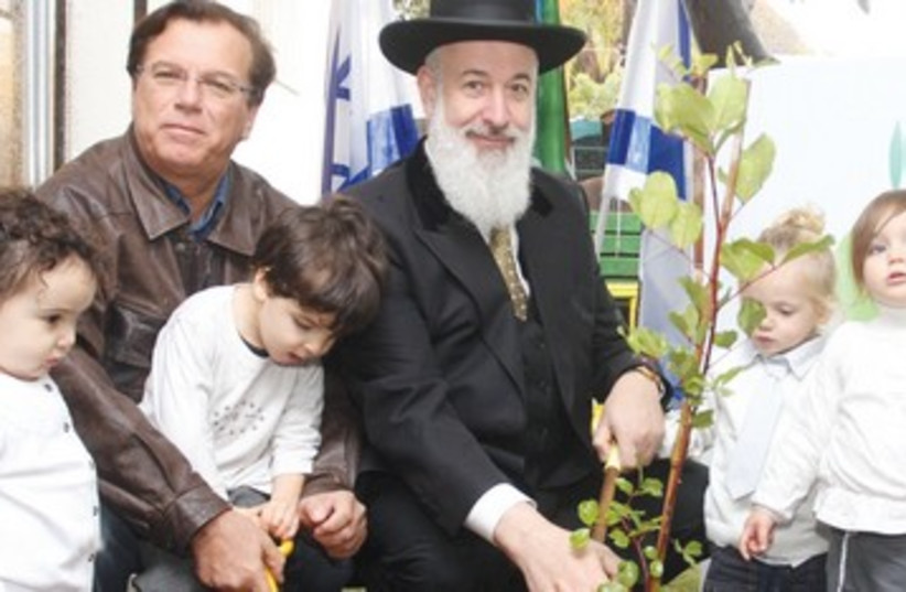 Rabbi  Metzger, JNF Chairman Stenzler plant trees (photo credit: Ancho Gosh)