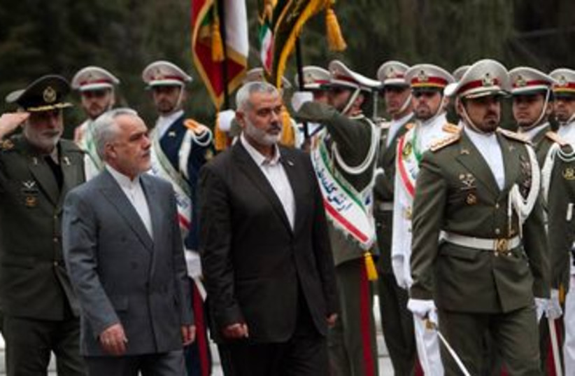 Hamas PM Ismail Haniyeh arrives in Tehran Iran 390 (R) (photo credit: REUTERS/Morteza Nikoubazl)