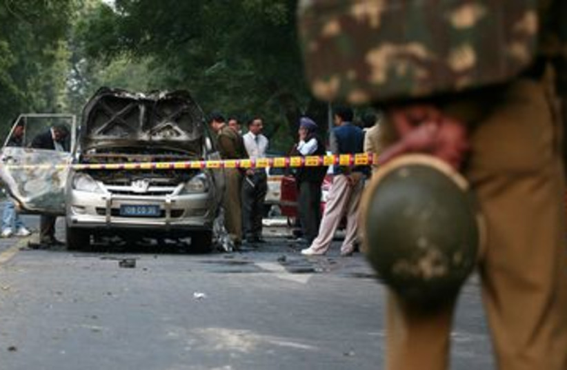Indian police inspect bombed car in New Delhi 390 (R) (photo credit: REUTERS/Parivartan Sharma)