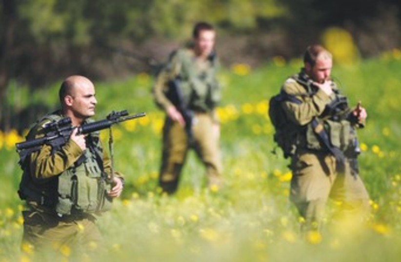 IDF soldiers near Ashkelon search for rockets_370 (photo credit: Amir Cohen/Reuters)